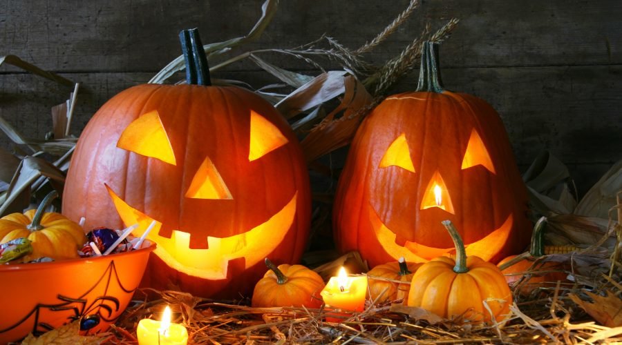halloween jack o lanterns with candles and candy
