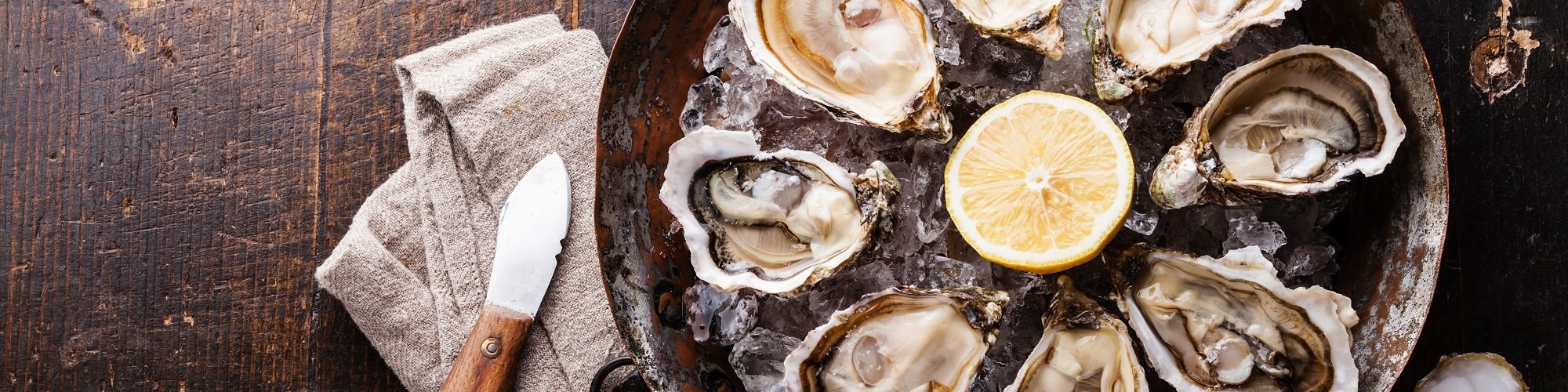 oysters on the half shell on a bed of ice for national oyster day