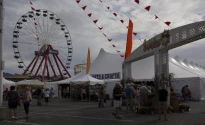 sunfest festival in ocean vity with arts and crafts tent and Ferris wheel