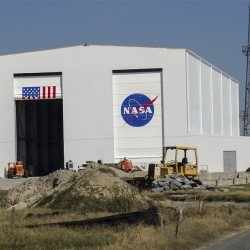 garage holding rockets with NASA logo