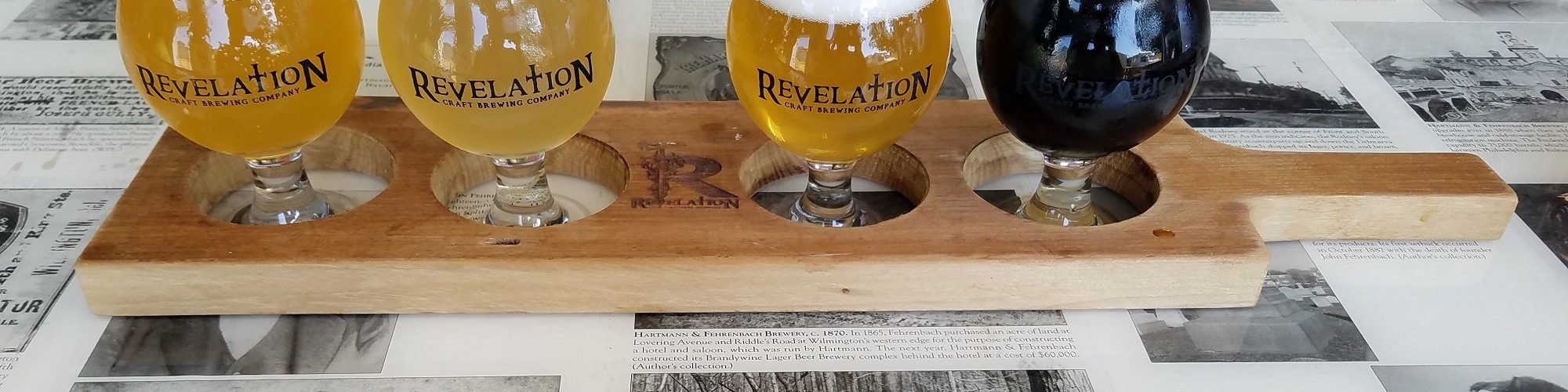 Revelation is an Eastern Shore Brewery with a flight of four beers on the bar