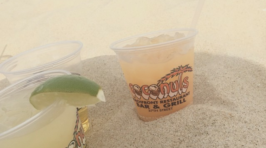 drinks in the sand on the beach at coconuts is one of 7 local favorites in ocean city
