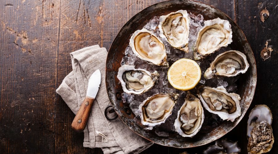 oysters on the half shell on a bed of ice for national oyster day