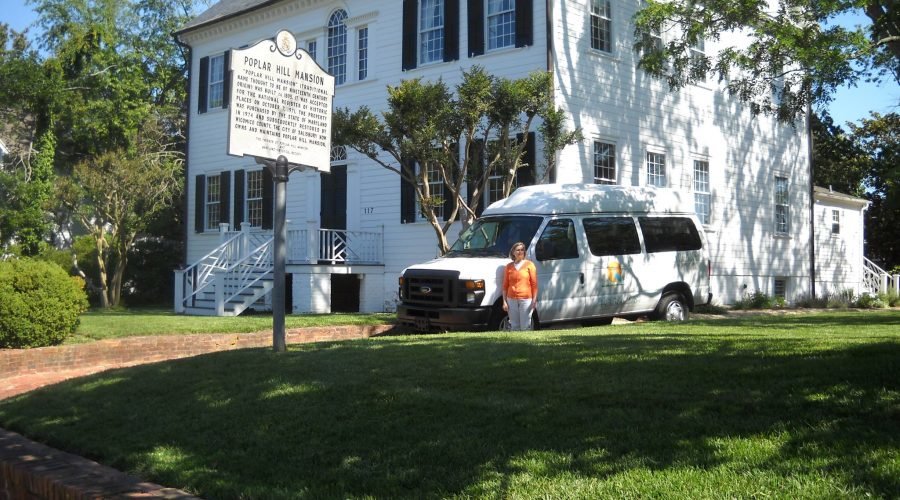 tour bus in front of Poplar Hill Mansion