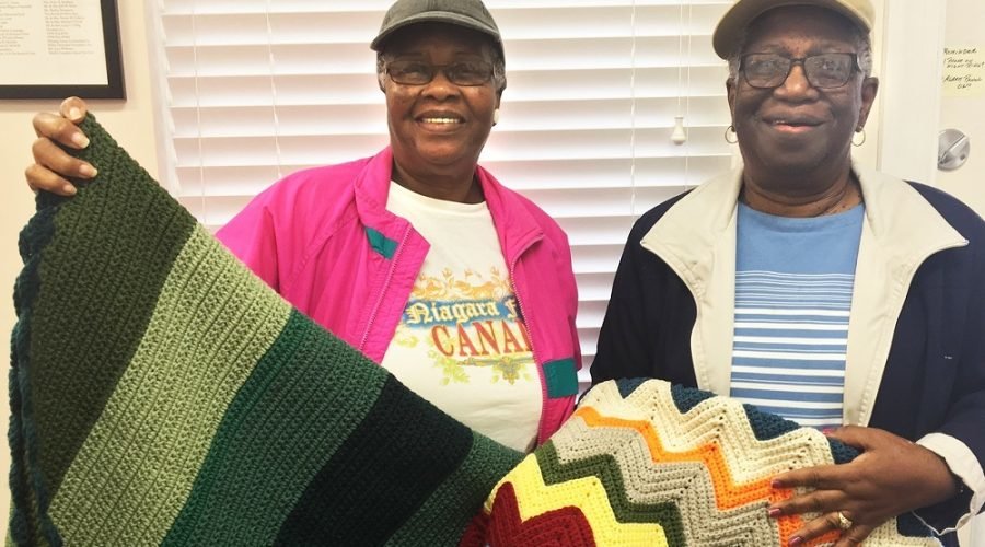 Fay Jarmon and Carolyn Fassett donated blankets for hospice patients at Coastal Hospice Racetrack Rd. office in October