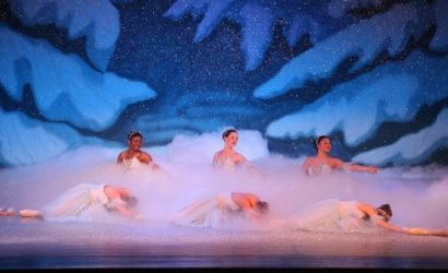 Eastern shore ballet theatre presents the nutcracker ballet with ballerinas in white tutus on stage