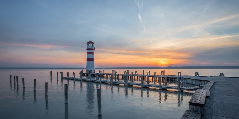 Lighthouse in Bay at Sunset