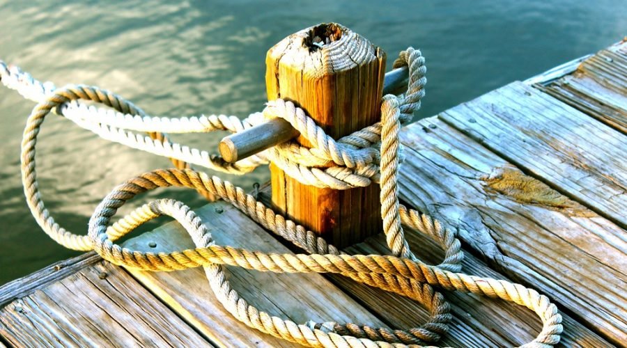 ropes at boat dock slip in harbor